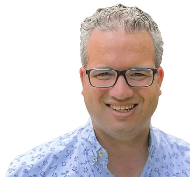 Man smiling in a floral shirt